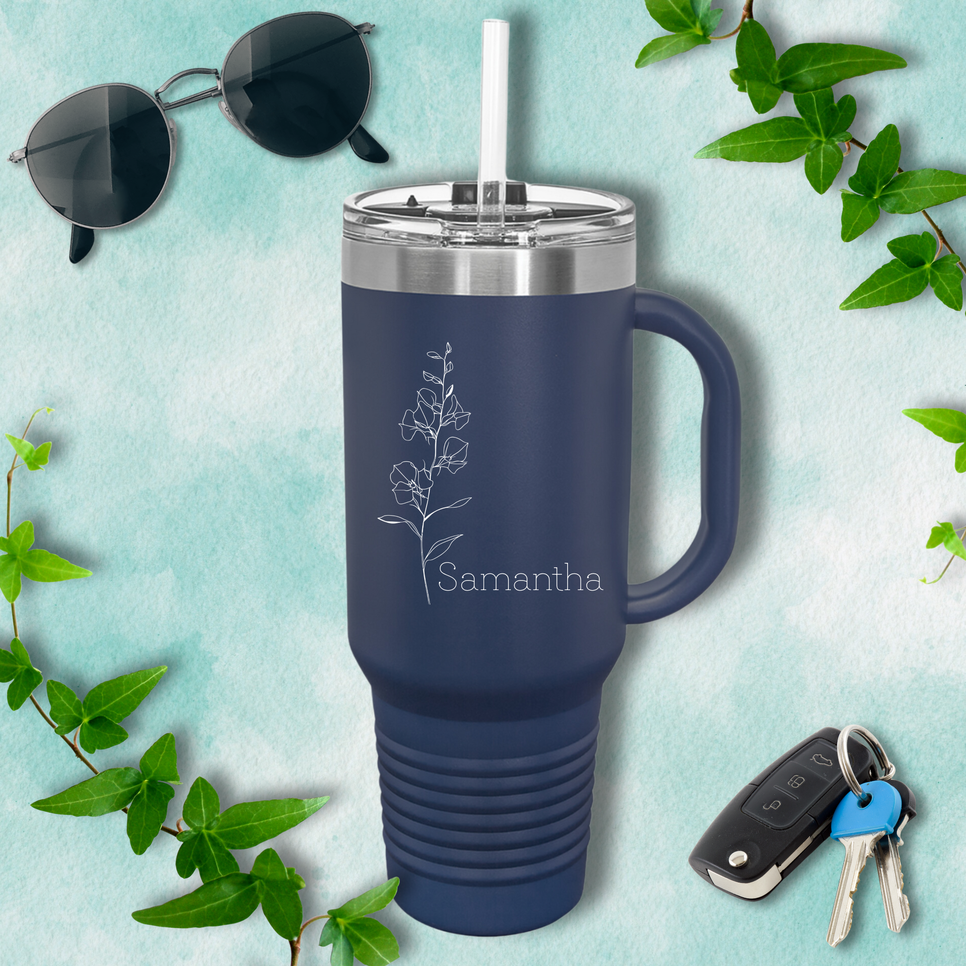 a blue travel mug with the name sammathia on it next to a pair