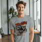 a man in a t - shirt is smiling for the camera