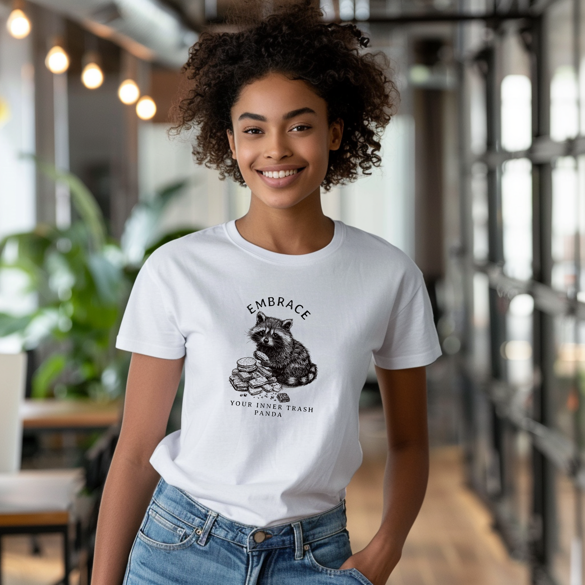 a woman wearing a white t - shirt with a koala on it