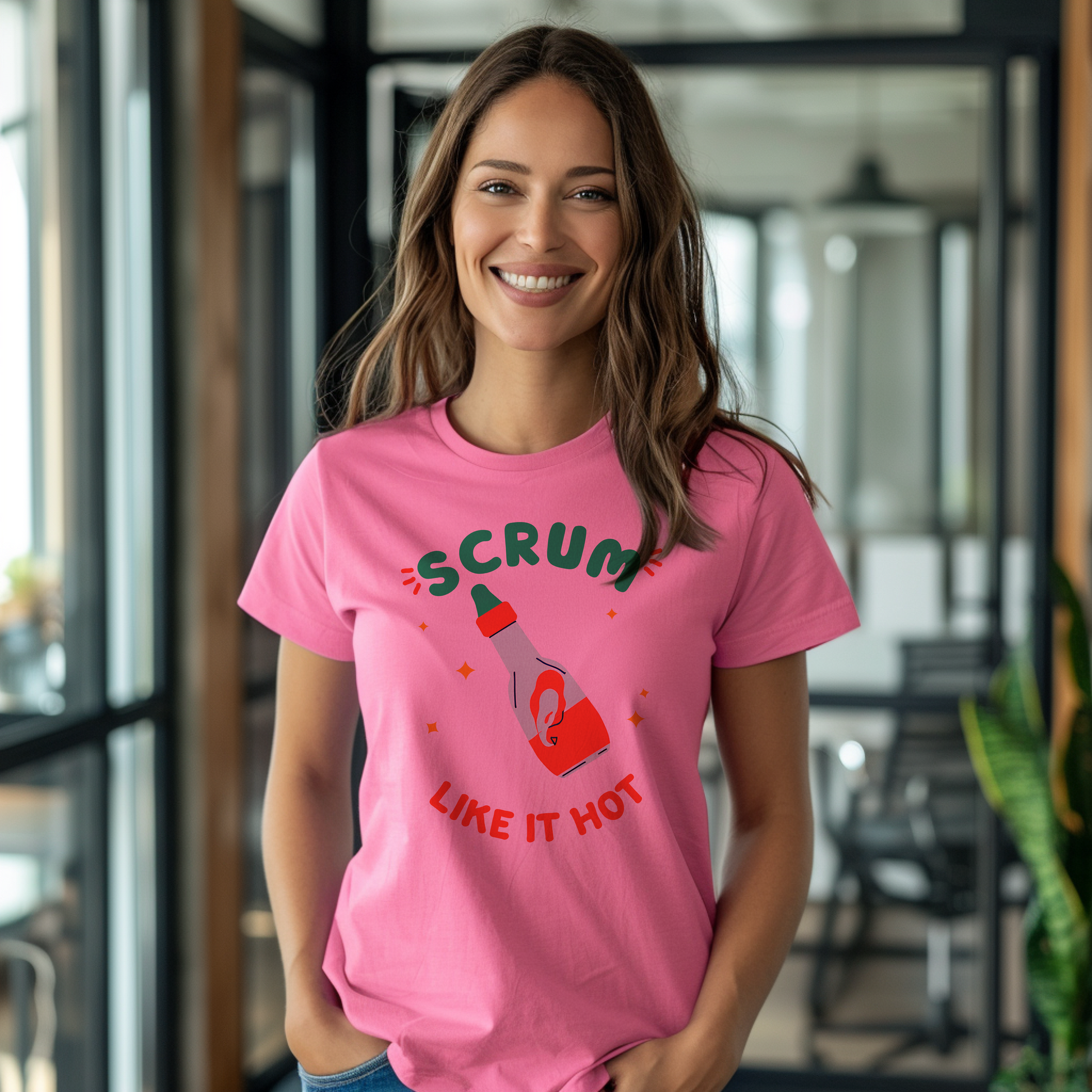 a woman wearing a pink t - shirt that says scrum like it hot