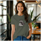 a woman wearing a t - shirt with a raccoon on it