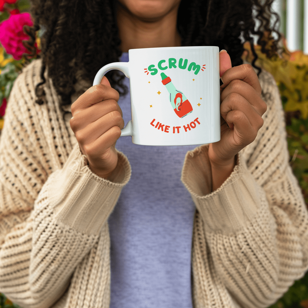 a woman holding up a coffee mug with the words scrum like it hot