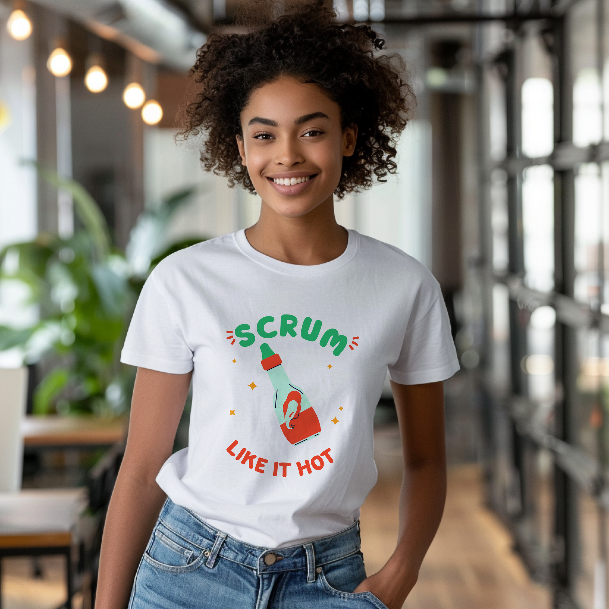 a woman wearing a t - shirt that says scrum like it hot