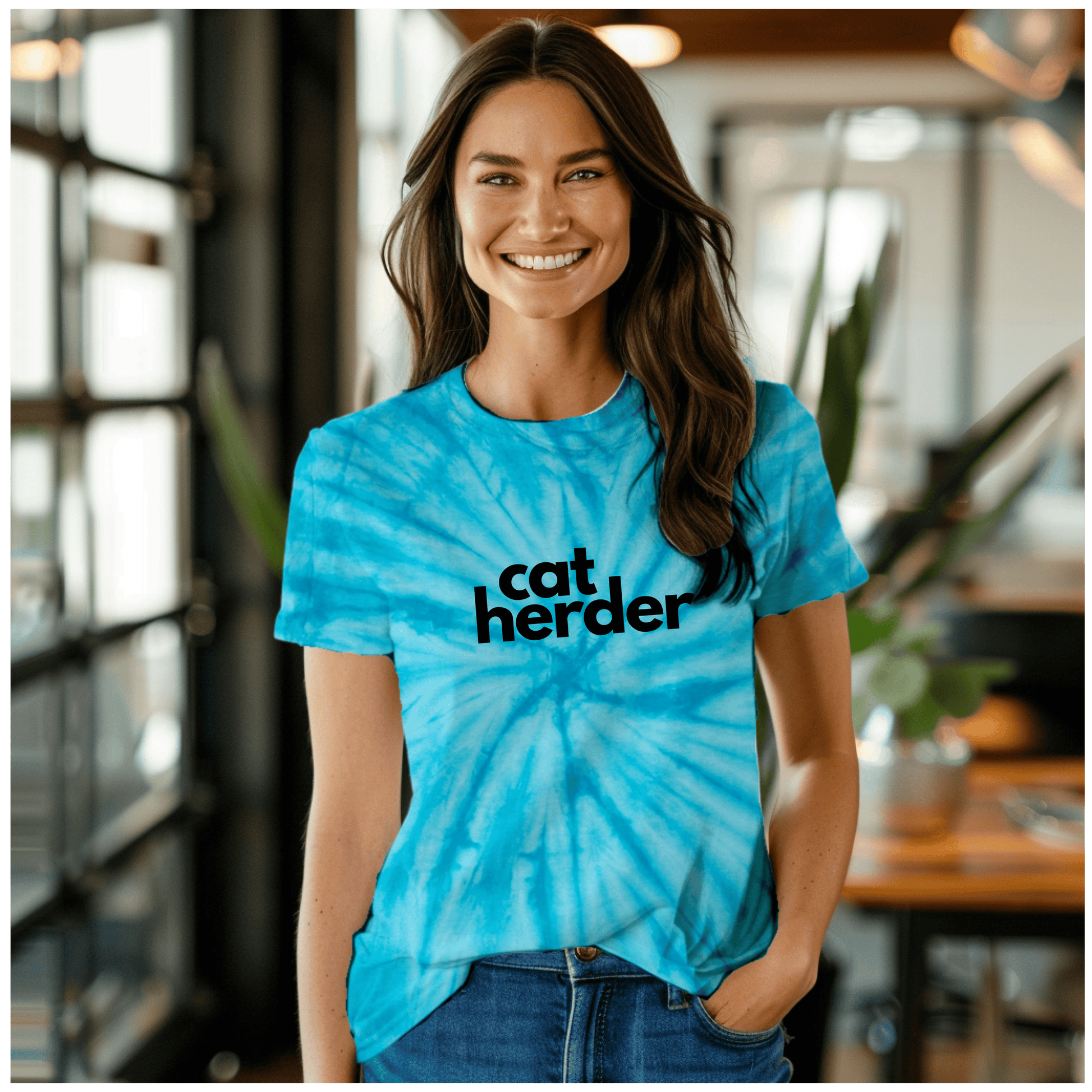 a woman wearing a catherder shirt standing in a room