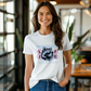 a woman wearing a white t - shirt with a wolf on it