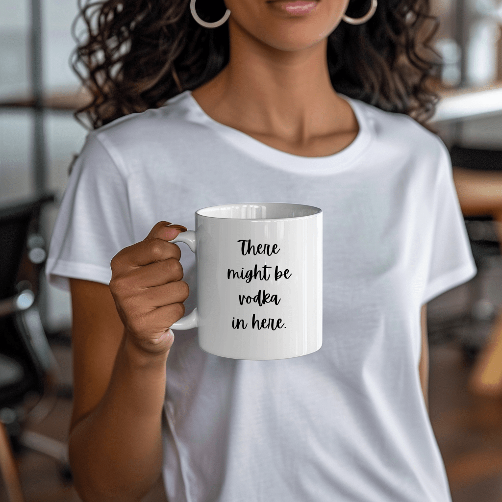 a woman holding a coffee mug with a quote on it