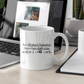 a coffee mug sitting on a desk next to a laptop