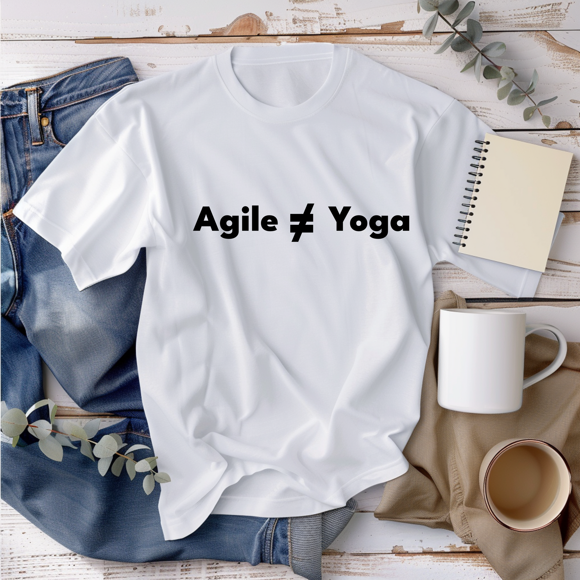 a t - shirt that says agile 4 yoga next to a cup of coffee