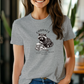 a woman wearing a gray t - shirt with a koala on it