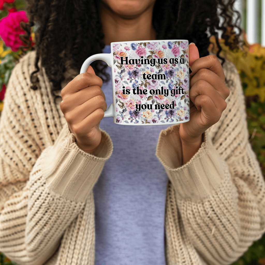 a woman holding a coffee mug with a quote on it