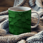 a cup of tea is sitting on a blanket