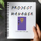 a hand holding a notebook with a project manager written on it