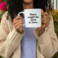 a woman holding a coffee mug with a quote on it