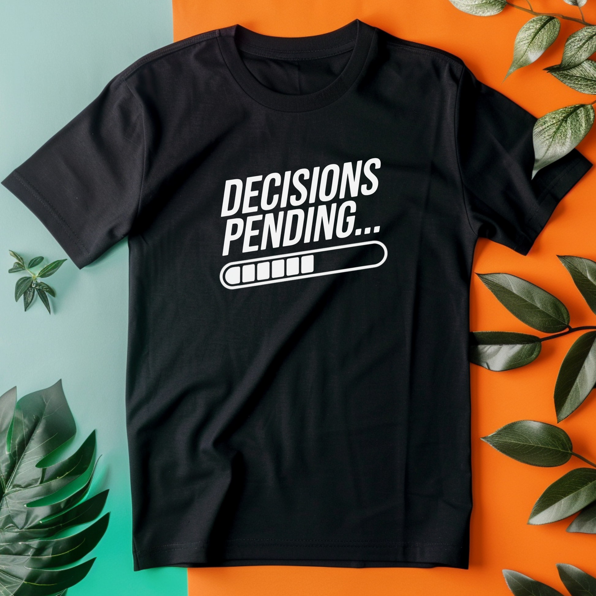 a black t - shirt with the words decision is spending on it