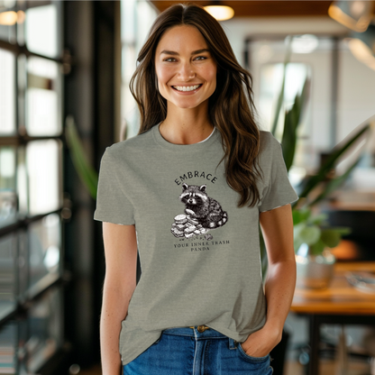 a smiling woman wearing a gray t - shirt with a raccoon on it