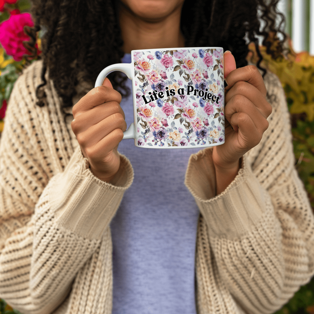 a woman holding a coffee mug in her hands