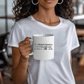 a woman is holding a coffee mug in her hands