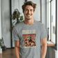 a smiling man in a t - shirt with a raccoon on it