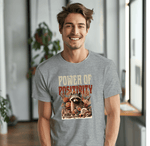 a smiling man in a t - shirt with a raccoon on it