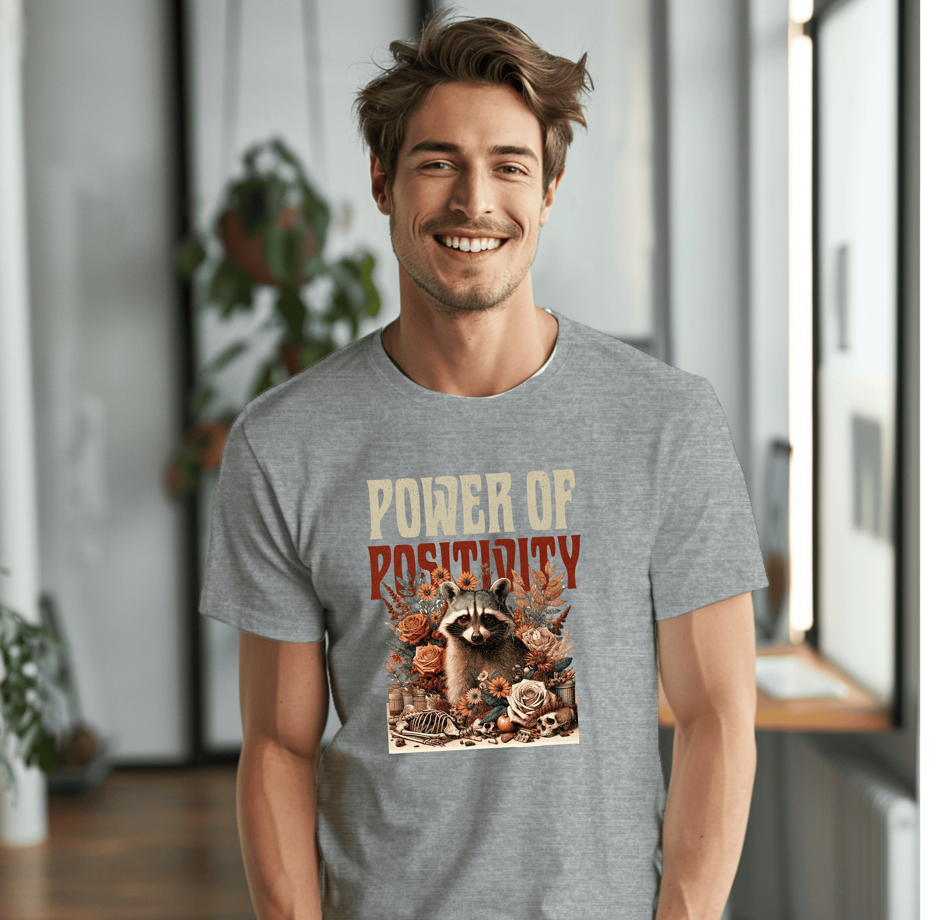 a smiling man in a t - shirt with a raccoon on it