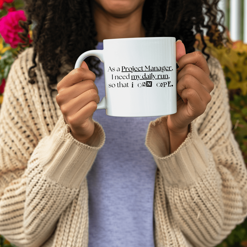 a woman holding a coffee mug in front of flowers