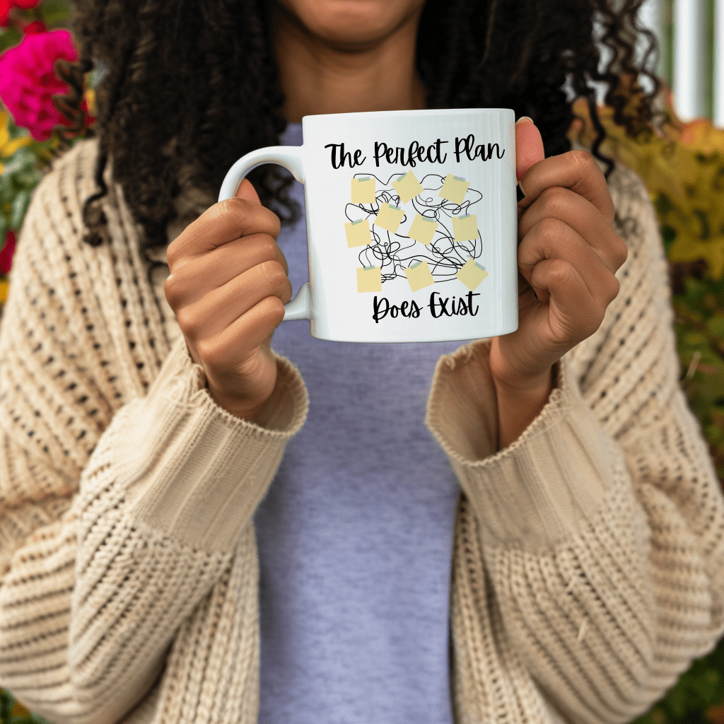 a woman holding up a coffee mug with the words the perfect plan perks last