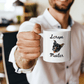 a man holding a coffee mug with a dog on it