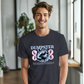 a man standing in front of a window wearing a dumpster t - shirt