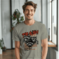 a man wearing a t - shirt with a raccoon on it