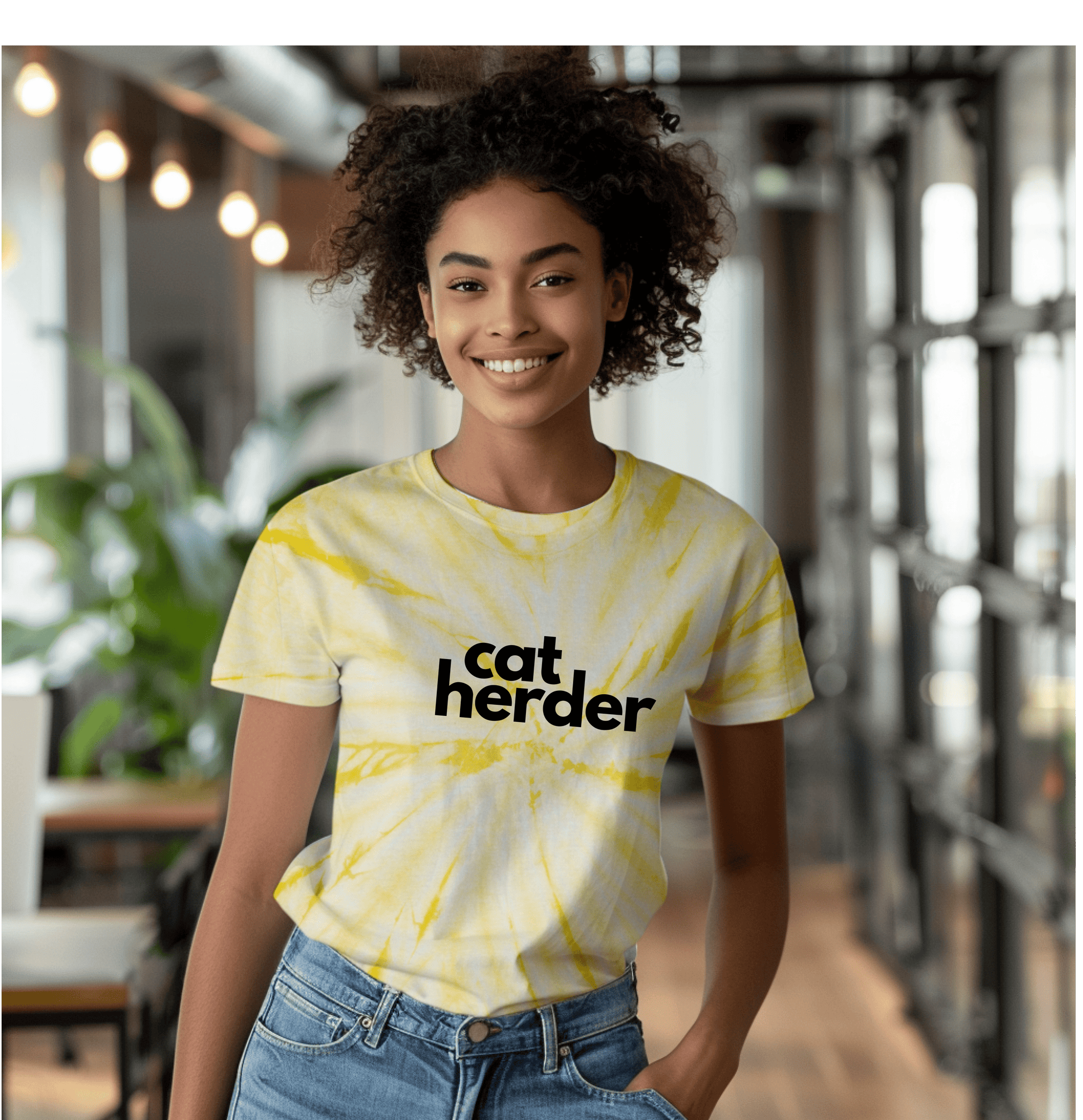 a woman wearing a yellow cat herder t - shirt