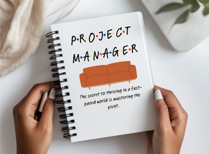 a person holding a notebook with the title project manager