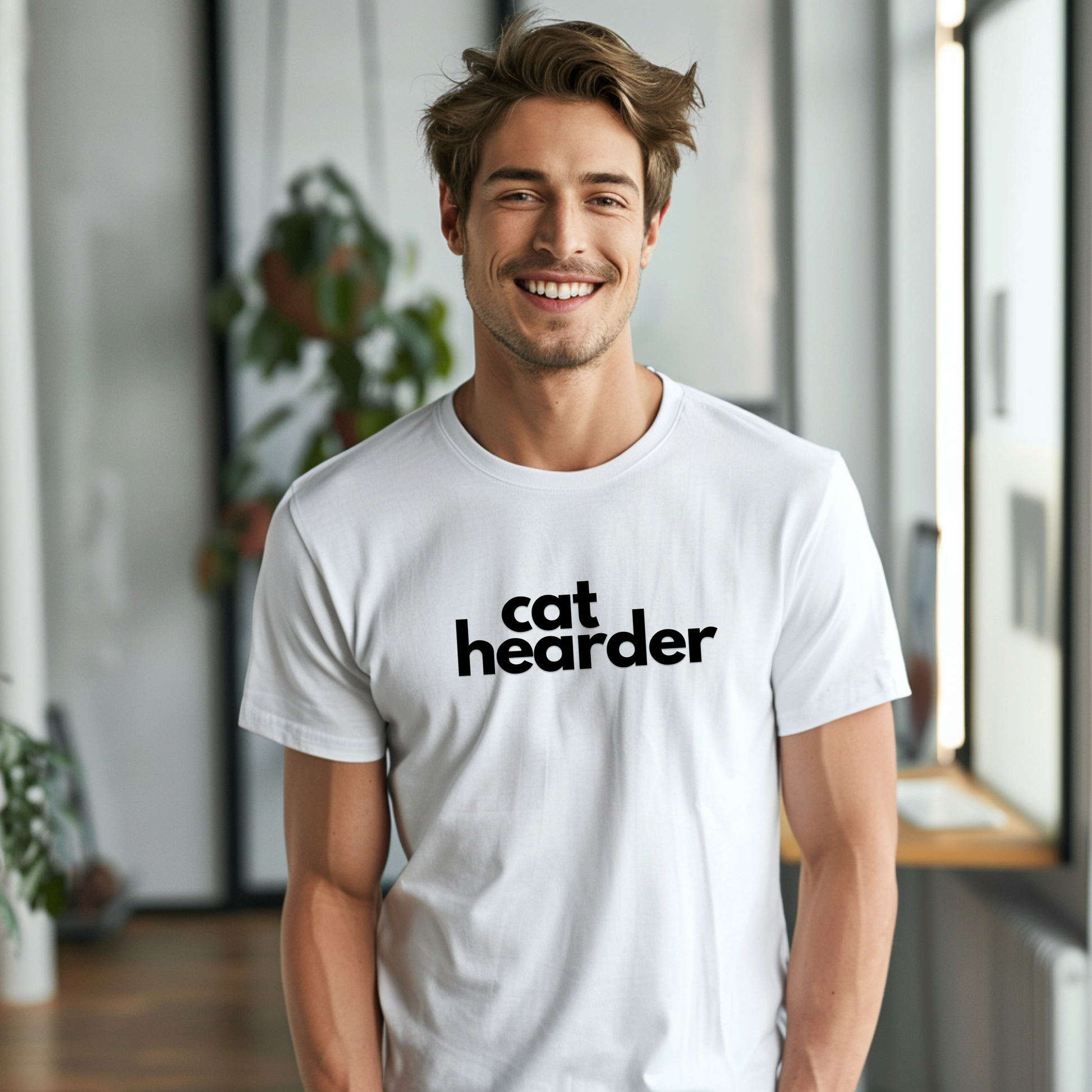 a man wearing a white shirt with the word cat headed on it