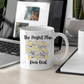 a white coffee mug sitting on top of a desk