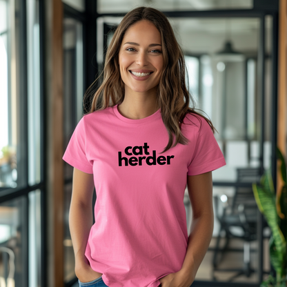 a woman wearing a pink cat herder t - shirt