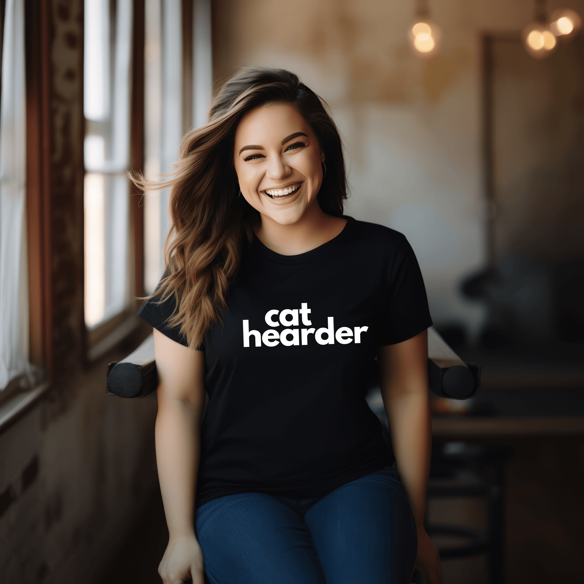 a woman sitting in a chair with a cat header t - shirt on