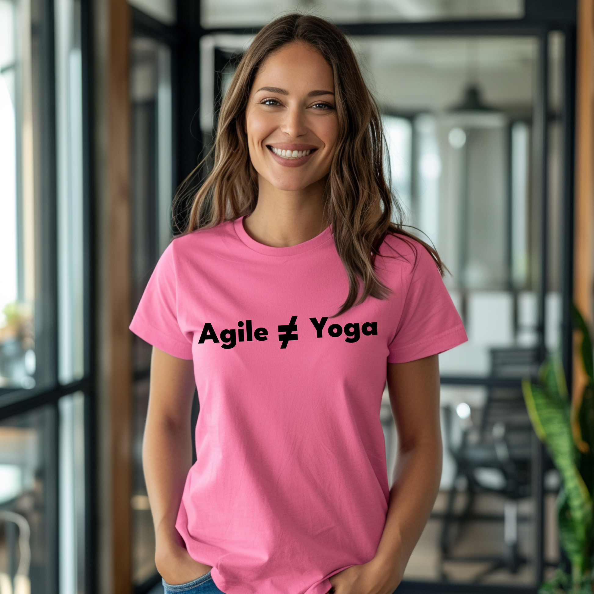 a woman wearing a pink t - shirt that says agile yoga