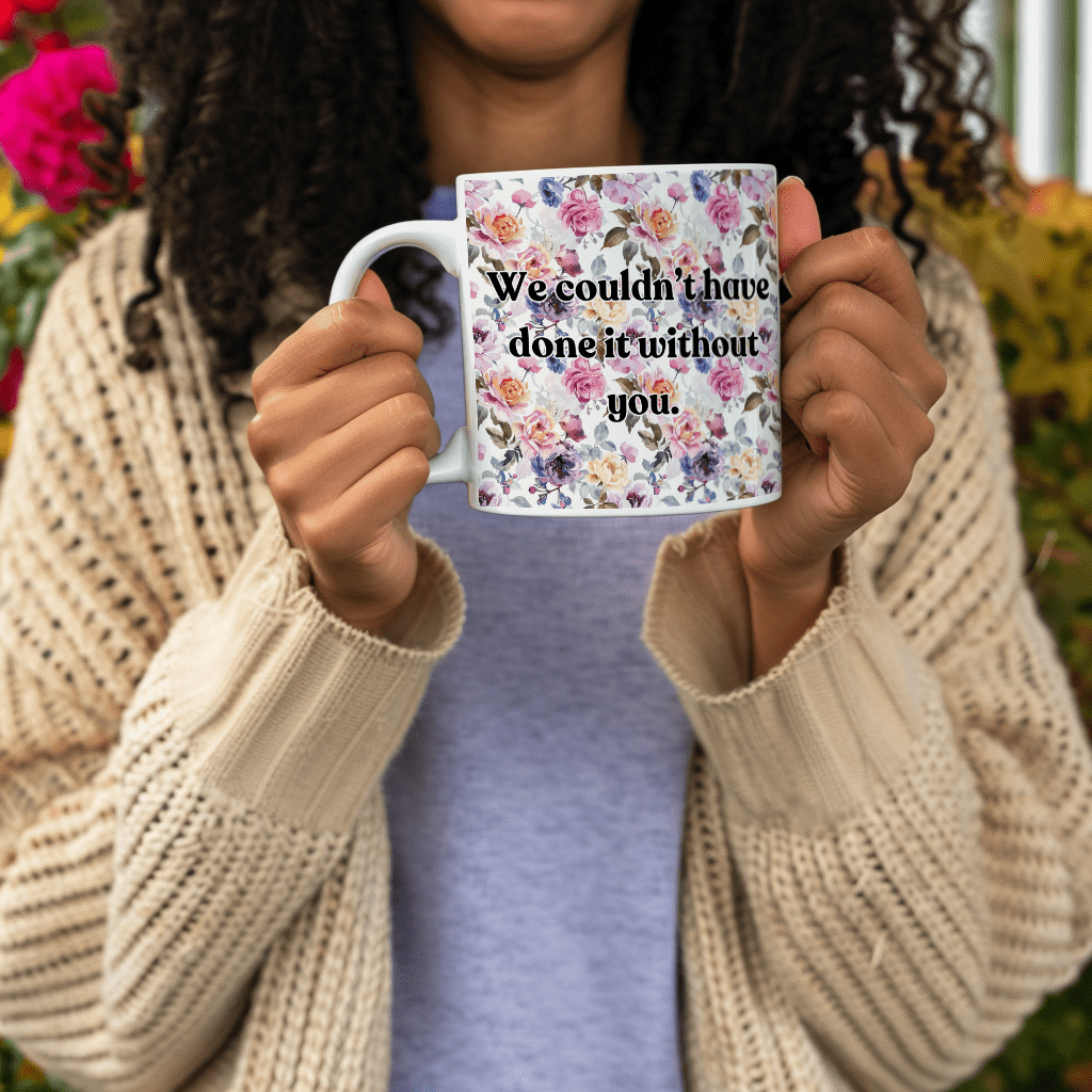 a woman holding a coffee mug with a quote on it