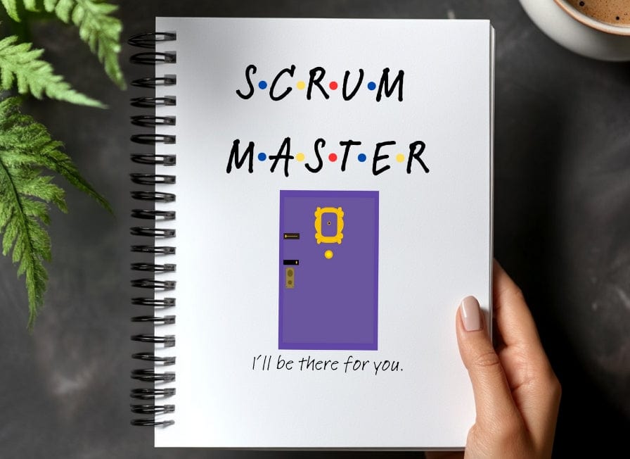 a hand holding a notebook with the words scrum master on it