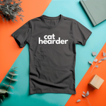 a black t - shirt with the word cat hearder printed on it