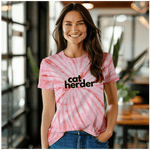 a woman wearing a catherder shirt standing in a room