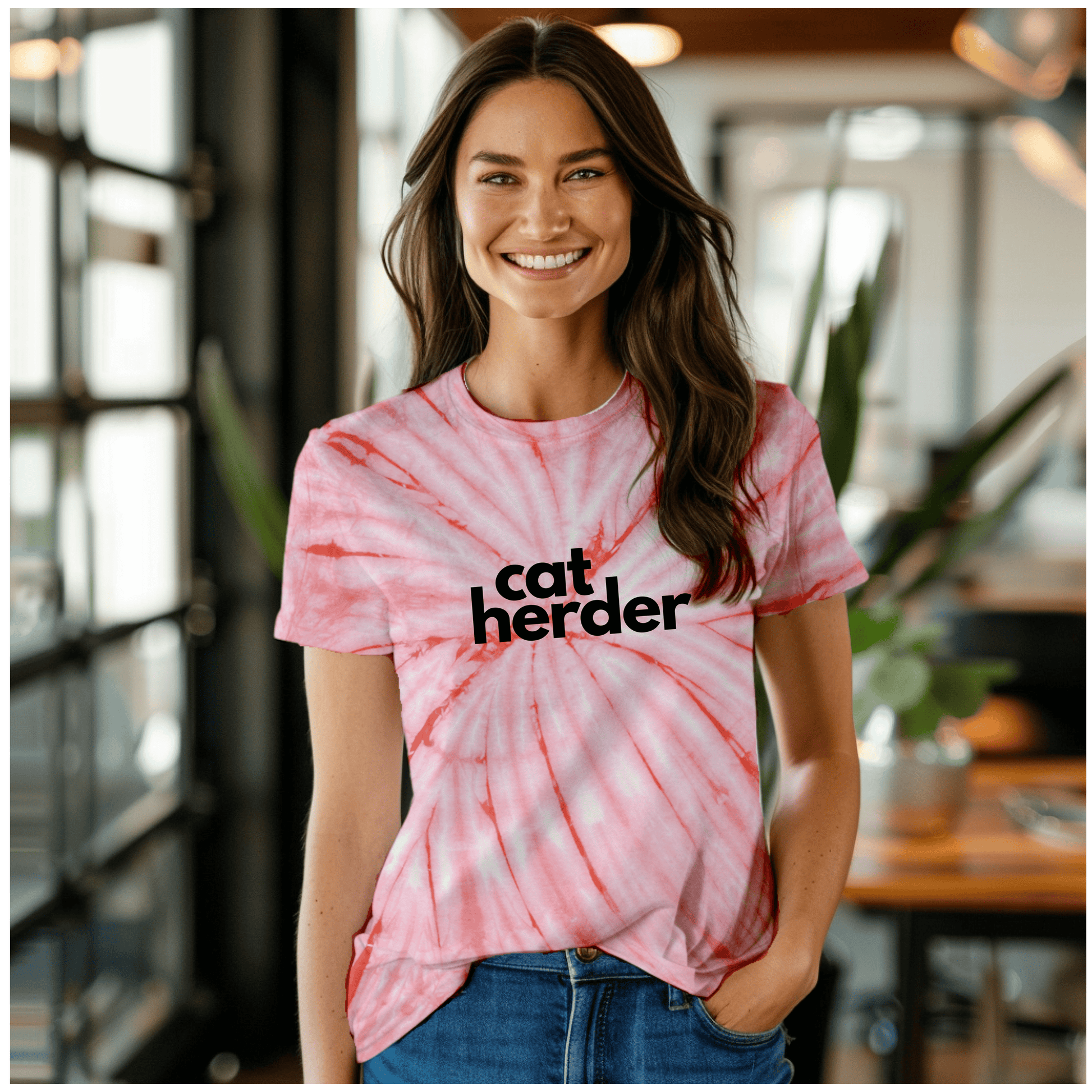 a woman wearing a catherder shirt standing in a room