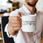 a man holding a coffee mug in his hand