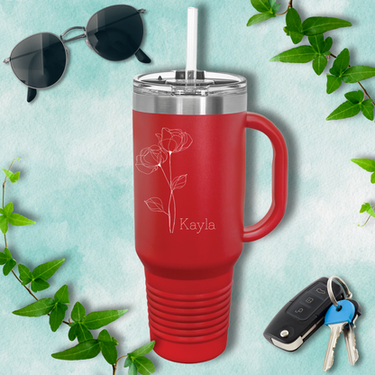 a red travel mug next to a pair of sunglasses and keys