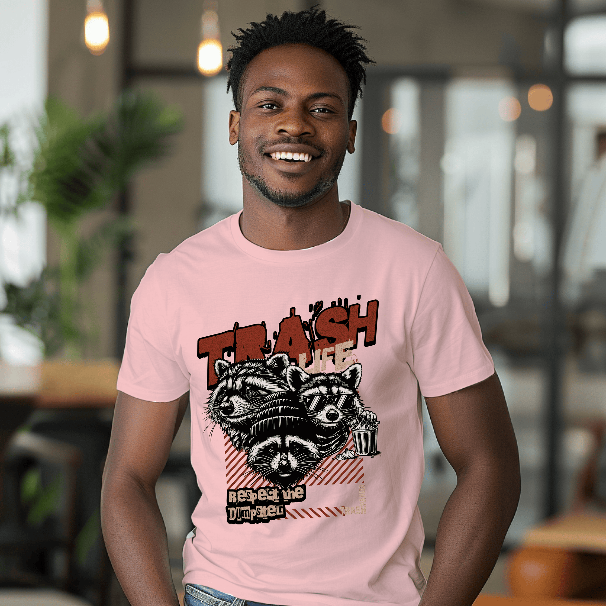 a man wearing a pink shirt with a raccoon on it