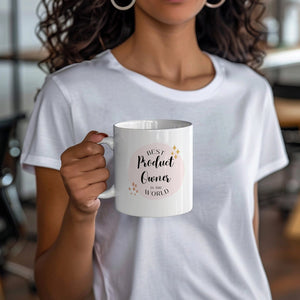 a woman is holding a coffee mug in her hands